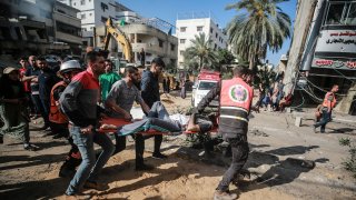 Search and rescue works are conducted at debris of a building after airstrikes by Israeli army hit buildings in al-Rimal neighborhood of Gaza City, Gaza on May 16, 2021.