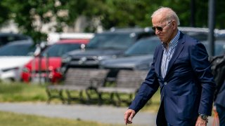 U.S. President Joe Biden walks on the Ellipse to board Marine One on May 22, 2021 in Washington, DC.