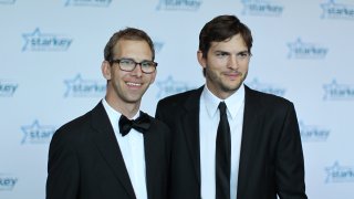 Michael Kutcher and brother Ashton Kutcher walk the red carpet before the 2013 Starkey Hearing Foundation's "So the World May Hear" Awards Gala on July 28, 2013 in St. Paul, Minnesota.