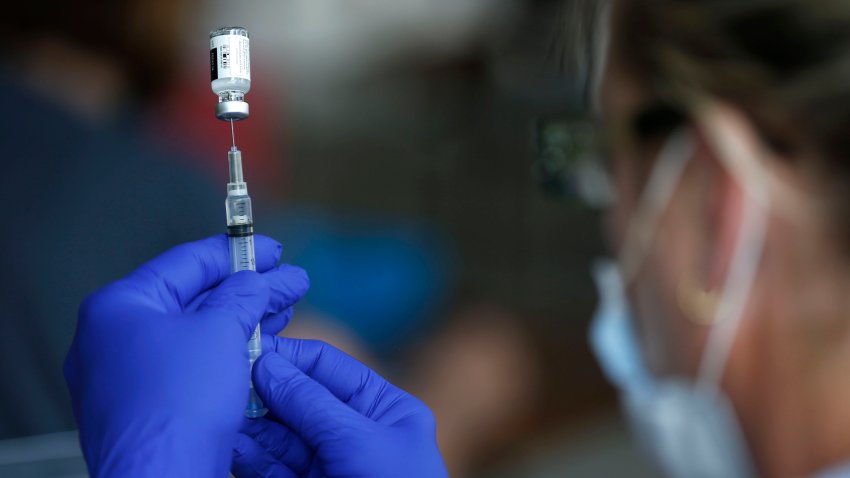 Nurse Jody Berry draws a syringe full of the Johnson & Johnson COVID-19 vaccine at a clinic at Mother’s Brewing Company in Springfield, Mo., on Tuesday, June 22, 2021. As the U.S. emerges from the COVID-19 crisis, Missouri is becoming a cautionary tale for the rest of the country: It is seeing an alarming rise in cases because of a combination of the fast-spreading delta variant and stubborn resistance among many people to getting vaccinated. (Nathan Papes/The Springfield News-Leader via AP)