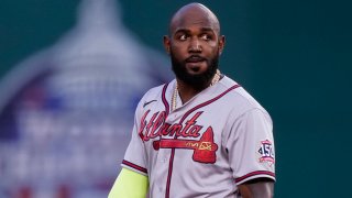 In this May 4, 2021, file photo, Atlanta Braves' Marcell Ozuna stands on the field during the inning of baseball game against the Washington Nationals at Nationals Park in Washington, D.C.