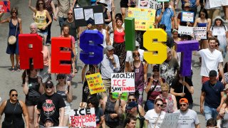 Protesters march to offices of the U.S. Immigration and Customs Enforcement on July 13, 2019 in Chicago, Illinois.