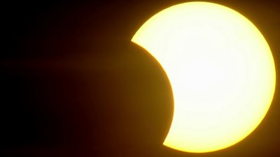 Why do clouds disappear during a solar eclipse?