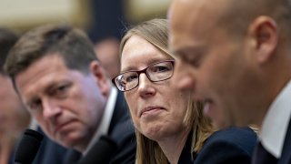 Hester Peirce, commissioner of the U.S. Securities and Exchange Commission (SEC), center, listens during a House Financial Services Committee hearing in Washington, D.C., U.S., on Tuesday, Sept. 24, 2019.