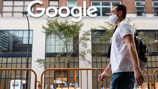 A person wears a face mask outside Google’s offices in Chelsea as the city continues Phase 4 of re-opening following restrictions imposed to slow the spread of coronavirus on September 29, 2020 in New York City.