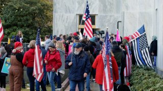 pro-Trump and anti-mask demonstrators hold a rally outside the Oregon State Capitol