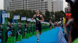 American triathlete Katie Zaferes competes during a women's triathlon test event at Odaiba Marine Park, a venue for marathon swimming and triathlon at the Tokyo 2020 Olympics, Thursday, Aug. 15, 2019, in Tokyo.