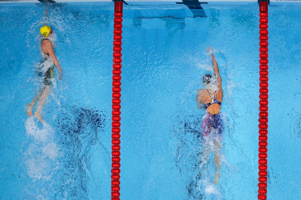 Ariarne Titmus, left, of Australia wins the final of the women's 400-meters freestyle ahead of Katie Ledecky, of the United States, at the 2020 Summer Olympics, Monday, July 26, 2021, in Tokyo, Japan.