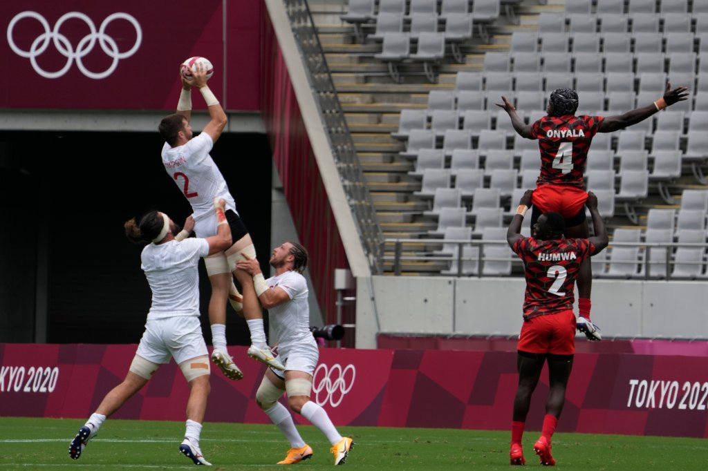 Brett Thompson of the U.S., top left, is lifted by teammates to catch a ball on a lineout in the U.S.' men's rugby sevens match against Kenya at the 2020 Summer Olympics, Monday, July 26, 2021 in Tokyo, Japan.