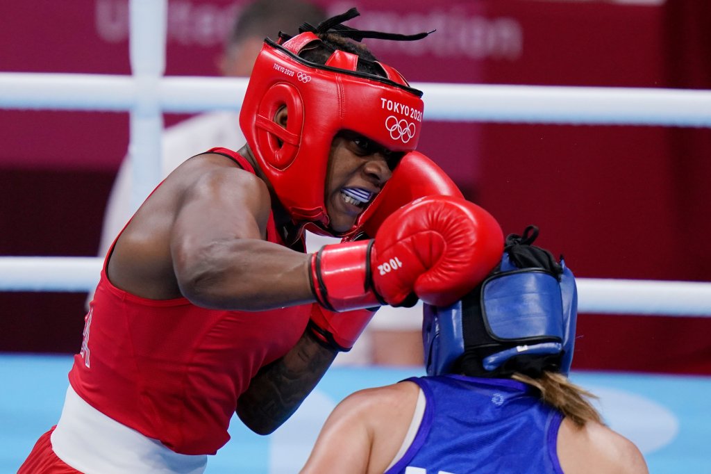 Oshae Jones of US, left, exchanges punches with Mexico's Brianda Tamara Cruz Sandoval during the women's welterweight 69-kg boxing match at the 2020 Summer Olympics, Tuesday, July 27, 2021, in Tokyo, Japan.