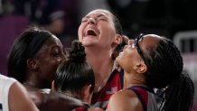 United States' Stefanie Dolson, top, celebrates with teammates Jacquelyn Young, left, Kelsey Plum and Allisha Gray, right, after defeating Russian Olympic Committee in a women's 3-on-3 gold medal basketball game at the 2020 Summer Olympics, Wednesday, July 28, 2021, in Tokyo, Japan.