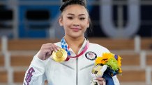 Gold medallist Sunisa Lee of the Unites States displays her medal for the artistic gymnastics women's all-around at the 2020 Summer Olympics, Thursday, July 29, 2021, in Tokyo. Lee took home gold for the United States for the fifth year running in this category.