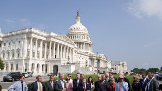 Representative Josh Gottheimer, a Democrat from New Jersey and co-chair of the House Problem Solvers Caucus, center, speaks during a news conference outside the U.S. Capitol in Washington, D.C., U.S., on Friday, July 30, 2021.