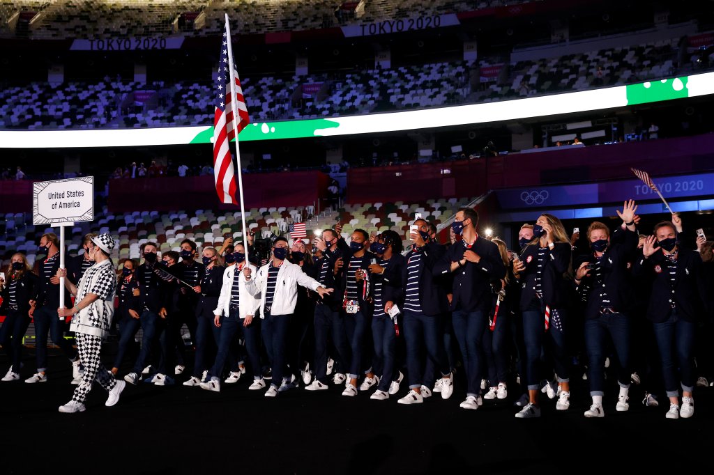 Flag bearers Sue Bird and Eddy Alvares of Team United States lead their team out during the Opening Ceremony of the Tokyo 2020 Olympic Games at Olympic Stadium on July 23, 2021 in Tokyo, Japan.