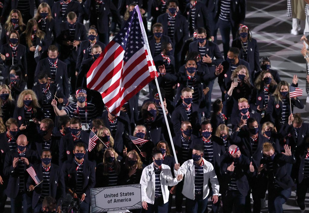 Flag bearers Sue Bird and Eddy Alvares of Team United States lead their team out during the Opening Ceremony of the Tokyo 2020 Olympic Games at Olympic Stadium on July 23, 2021 in Tokyo, Japan.