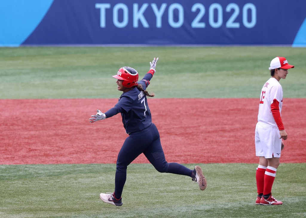 Kelsey Stewart #7 of Team United States celebrates while rounding second base after hitting a walk-off home run in the eighth inning as Mana Atsumi #12 of Team Japan looks on during softball opening round on day three of the Tokyo 2020 Olympic Games at Yokohama Baseball Stadium on July 26, 2021 in Yokohama, Kanagawa, Japan. Team United States defeated Team Japan 2-1.