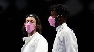 Jacob Hoyle of Team United States, left, and Curtis McDowald of Team United States reacts to their loss to Team Japan in Men's Épée Team Table of 16 on day seven of the Tokyo 2020 Olympic Games at Makuhari Messe Hall on July 30, 2021 in Chiba, Japan.