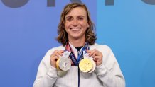 Katie Ledecky of Team USA holds up the four medals she won during the Tokyo Games, July 31, 2021 in Tokyo, Japan. Ledecky won two golds for her performance in the women's 800-meter and 1500-meter freestyle races, as well as two silvers for the 400-meter freestyle and 4x200 freestyle relay.
