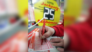 Photo illustration of a lottery ticket being filled out.