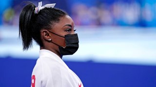 Simone Biles watches competition 