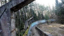 TO GO WITH STORY BY RUSMIR SMAJILHODZIC - A picture taken on February 5, 2014 shows Sarajevo's abandoned Sarajevo's bob sleigh track near Sarajevo. Built and used as an Olympic venue during Sarajevo's 1984 Winter Olympic Games, the track was heavily damaged during Bosnia's 1992-95 war. It was never rebuilt and it's large concrete fragments remain standing as a memento of past and training ground for young generations of graffiti artists. AFP PHOTO ELVIS BARUKCIC / AFP / ELVIS BARUKCIC (Photo credit should read ELVIS BARUKCIC/AFP via Getty Images)