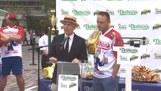 Joey Chestnut (right) weighs in for the Nathans Famous Hot Dog Eating Contest where he's set to defund his title and record.