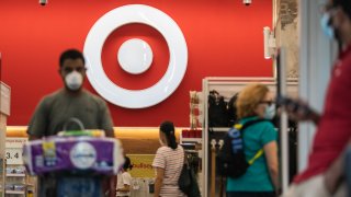 Shoppers wear protective masks inside a Target Corp. store in New York, U.S., on Saturday, Aug. 15, 2020. Target is scheduled to release earnings figures on August 19.
