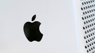 the Apple logo displayed on a Mac Pro desktop computer