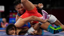 United States's Jacarra Gwenisha Winchester, top, competes against Cuba's Laura Herin Avila