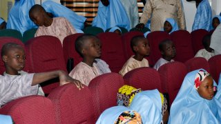 Some freed students from the Salihu Tanko Islamic School are reunited with their parents in Minna, Nigeria, Friday, Aug. 27, 2021.