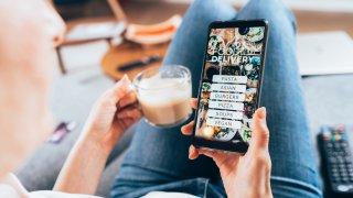 Woman ordering food online on her electronic device
