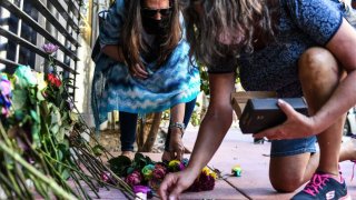 Women lay flowers outside the Albion Hotel in Miami, on March 26, 2021 to honor 24-year-old Pennsylvania woman Christine Englehardt who was found dead in her hotel room. – Two men are accused of drugging and raping Englehardt, who was later found dead in her room, though no cause of death has been determined, US media reported. (Photo by CHANDAN KHANNA / AFP) (Photo by CHANDAN KHANNA/AFP via Getty Images)