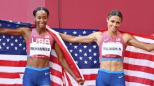 USA's Sydney Mclaughlin, right, celebrates her gold medal in the women's 400m hurdles. She sets a new world record with silver medalist USA's Dalilah Muhammad, left, during the Tokyo 2020 Olympic Games at the Olympic Stadium in Tokyo, Japan on Aug. 4, 2021.