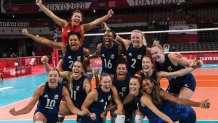 Team USA celebrates their victory in the women's semi-final volleyball match between USA and Serbia during the Tokyo 2020 Olympic Games at Ariake Arena in Tokyo on Aug. 6, 2021.