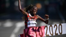 Peres Jepchirchir of Kenya crosses the finish line to win the Women's Marathon at Sapporo Odori Park on day 15 during the 2020 Tokyo Olympic Games in Sapporo, Japan.