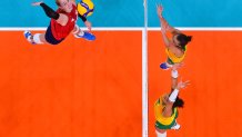 USA's Michelle Bartsch-Hackley (L) spikes the ball in the women's gold medal volleyball match between Brazil and USA during the Tokyo 2020 Olympic Games at Ariake Arena in Tokyo on Aug. 8, 2021.