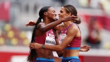 Silver medalist Dalilah Muhammad hugs gold medalist Sydney McLaughlin, both of Team United States, after competing in the Women's 400m Hurdles Final on day 12 of the Tokyo 2020 Olympic Games at Olympic Stadium on Aug. 4, 2021 in Tokyo, Japan.