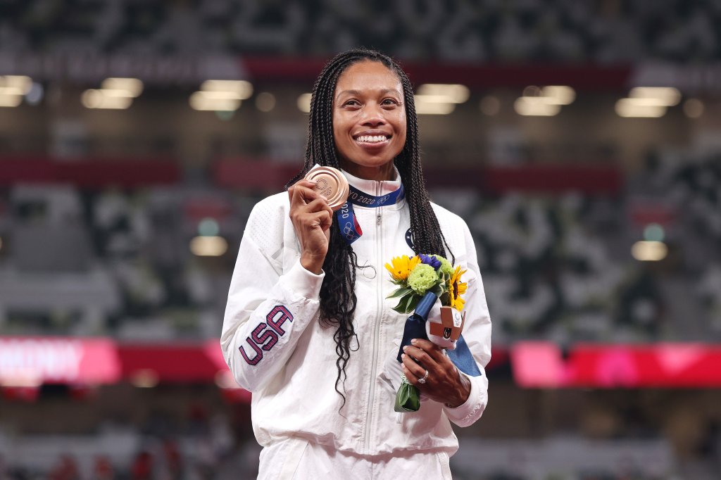 Bronze medalist Allyson Felix of Team USA holds up her medal on the podium during the medal ceremony for the women's 400m on day fourteen of the Tokyo 2020 Olympic Games at Olympic Stadium on Aug. 6, 2021, in Tokyo, Japan. Felix became the most decorated female athlete for track and field with her bronze medal win.