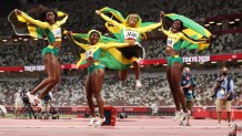 Briana Williams, Elaine Thompson-Herah, Shelly-Ann Fraser-Pryce and Shericka Jackson of Team Jamaica celebrate winning the gold medal in the Women's 4 x 100m Relay Final on day fourteen of the Tokyo 2020 Olympic Games at Olympic Stadium on Aug. 6, 2021 in Tokyo, Japan.