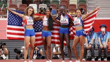 Sydney McLaughlin, Allyson Felix, Dalilah Muhammad and Athing Mu of Team USA celebrate winning the gold medal in the women' s 4 x 400m relay final on day fifteen of the Tokyo 2020 Olympic Games at Olympic Stadium on Aug. 7, 2021, in Tokyo, Japan.