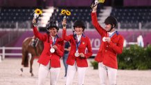 Laura Kraut, Jessica Springsteen and McLain Ward of Team United States pose with their silver medals on the podium during the jumping team final medal ceremony at Equestrian Park on Aug. 7, 2021 in Tokyo, Japan.