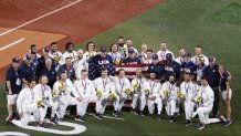 Silver medalists Team United States poses for photographs after the medal ceremony for baseball following the gold medal game between Team United States and Team Japan on day fifteen of the Tokyo 2020 Olympic Games at Yokohama Baseball Stadium on Aug. 7, 2021, in Yokohama, Kanagawa, Japan.