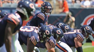 CHICAGO, ILLINOIS – AUGUST 14: Justin Fields #1 of the Chicago Bears calls the signals on his first play from scrimmage against the Miami Dolphins during a preseason game at Soldier Field on August 14, 2021 in Chicago, Illinois. (Photo by Jonathan Daniel/Getty Images)