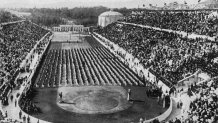 1896: View of athletes, standing in rows, and crowds filling the stadium at the 1896 Olympic Games in Athens, Greece. (Photo by Hulton Archive/Getty Images)