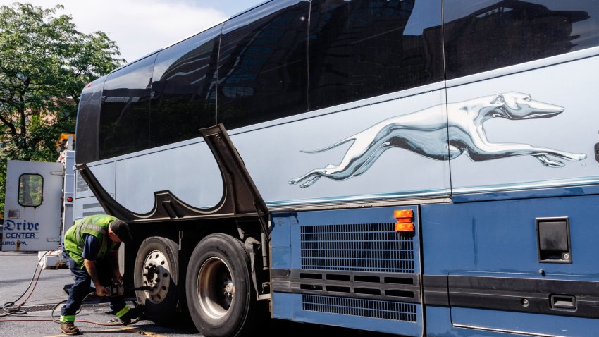 A man fixes a flat tire at Greyhound bus terminal. Greyhound Lines usually known as simply “Greyhound”, is an intercity bus common carrier which serve around 3800 destinations across North America.