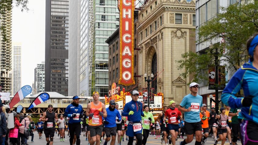 CHICAGO, ILLINOIS – OCTOBER 13: A general view of competitors runing past the Chicago Theater during the 2019 Bank of America Chicago Marathon on October 13, 2019 in Chicago, Illinois. (Photo by Quinn Harris/Getty Images)