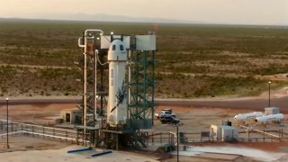 This photo provided by Blue Origin, Blue Origin's New Shepard rocket sits on a spaceport launch pad near Van Horn, Texas, Tuesday, July 20, 2021.