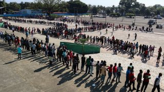 Migrants, mostly Haitians, wait for asylum processing by Mexico’s Commission for Refugee Assistance (COMAR) outside a soccer stadium, in Tapachula, Mexico October 12, 2021.