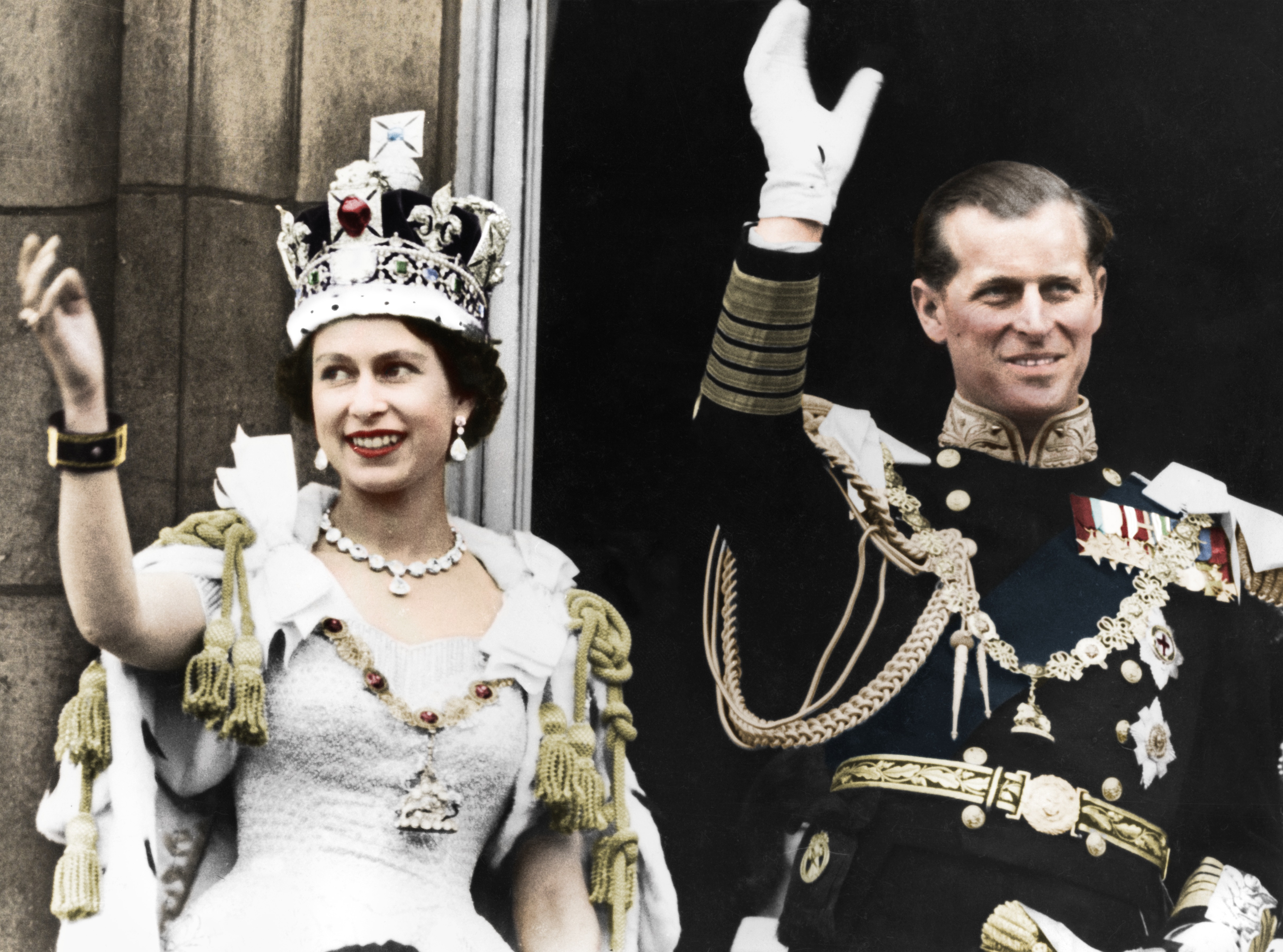 The newly crowned Queen Elizabeth II and the Duke of Edinburgh, seen on the day of her coronation at Buckingham Palace, June 2, 1953. The image is a colorized version of the original photo.