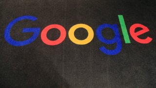 the logo of Google is displayed on a carpet at the entrance hall of Google France in Paris
